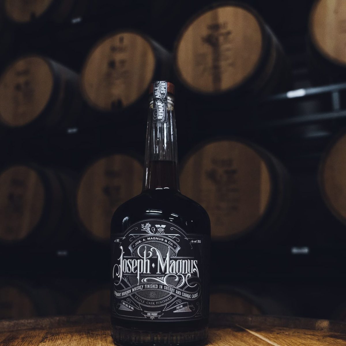The bottle on a barrel head in a barrel room