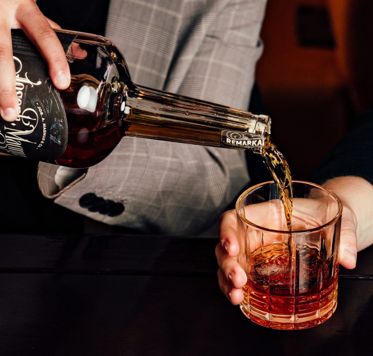 Joseph Magnus Bourbon poured into a friend's glass